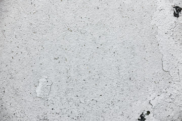 Texture of a concrete wall with cracks and scratches which can be used as a background