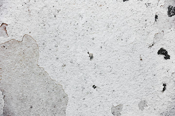 Texture of a concrete wall with cracks and scratches which can be used as a background