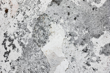 Texture of a concrete wall with cracks and scratches which can be used as a background