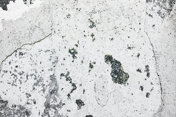 Texture of a concrete wall with cracks and scratches which can be used as a background