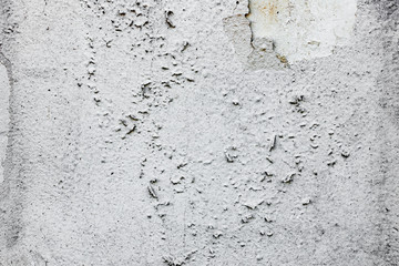 Texture of a concrete wall with cracks and scratches which can be used as a background