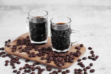 Coffee in cup and coffee beans on rustic table with a blank space for a text, Espresso in cup on white background