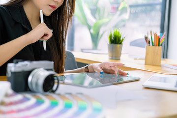 Cropped shot of freelance graphic designers hand working with stylus pen and tablet computer for...