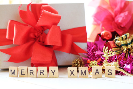 Wooden letter word " merry x mas"  with christmas gift boxing and x mas's decorations background. Christmas's day concept.