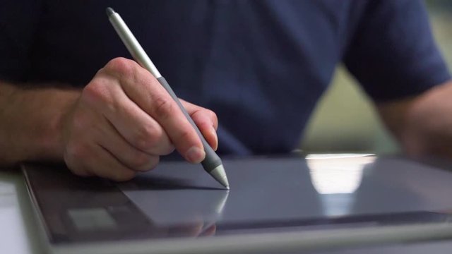 Designer drawing on graphic tablet