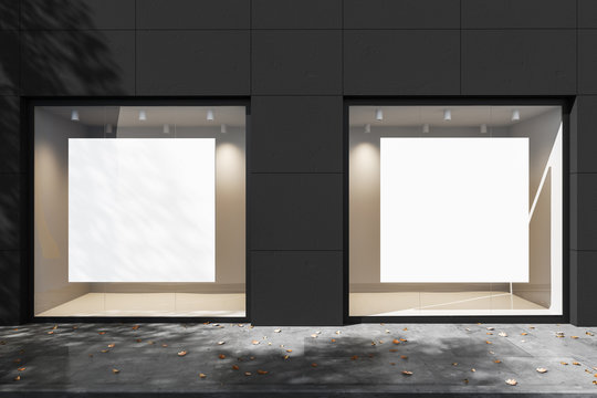 Exterior of a gray building with two square mock up posters in backlit windows. Mock up. 3d rendering