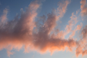 Fototapeta na wymiar Blue sky, pink clouds, sunset.
