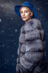 fur coat and felt hat