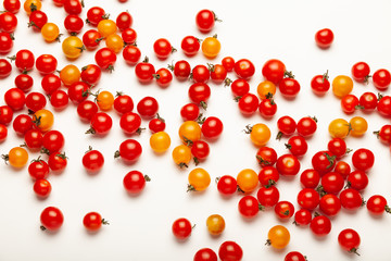 Red and yellow cherry tomatoes, fresh bright organic vegetables.