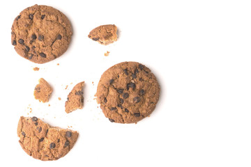 Sweet cookies with raisins isolated on a white background. Whole cookies and pieces and crumbs of cookies.