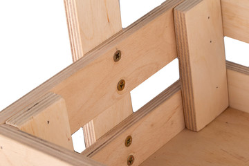 Fragment of a wooden box close-up on a white background