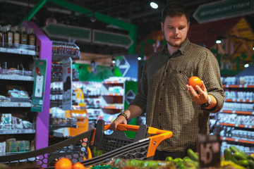 man do shopping in grocery store