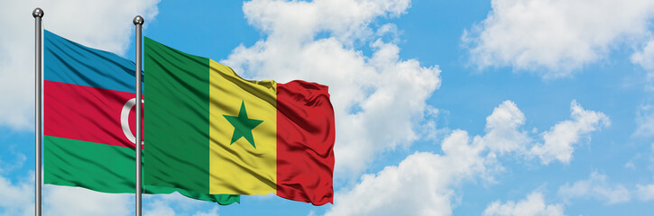 Fototapeta na wymiar Azerbaijan and Senegal flag waving in the wind against white cloudy blue sky together. Diplomacy concept, international relations.
