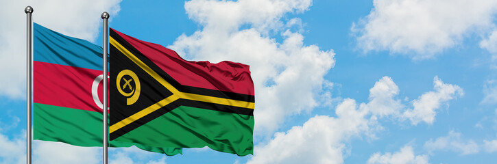 Azerbaijan and Vanuatu flag waving in the wind against white cloudy blue sky together. Diplomacy concept, international relations.