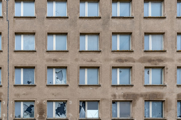 Full frame of broken windows in old building facade