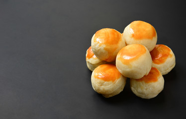 top view stack of Chinese pastry or Chinese spring rolls on black color background with copy space