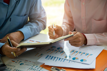 Businessman team is analyzing the cost of housing projects to live with lifestyle.business concept,...