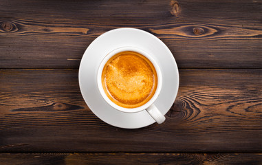 Overhead view of a freshly brewed mug of espresso coffee