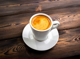 Overhead view of a freshly brewed mug of espresso coffee