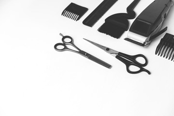 Hairdressing tools in black and white on a white background with copy space on the right