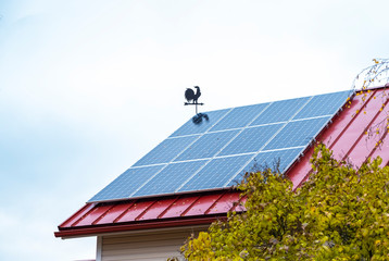 Solar panels on the roof of a house in northern Europe. Finland. Alternative energy.
