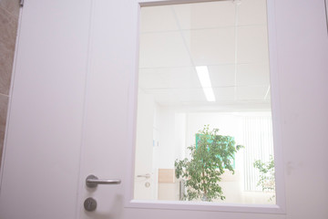 door in a hospital with a glass window