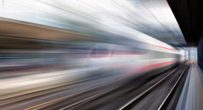 High speed train runs on rail tracks . Train in motion