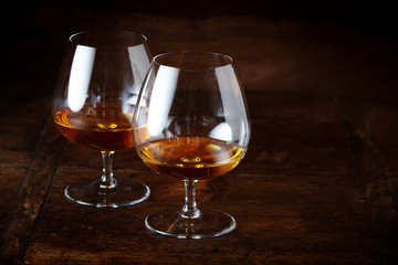 Two cognac snifter glasses with copy space