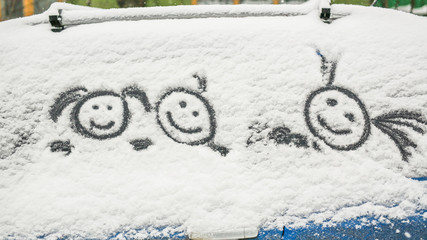 Dirty car in the snow on a village street