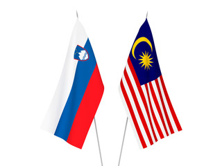 National fabric flags of Malaysia and Slovenia isolated on white background. 3d rendering illustration.