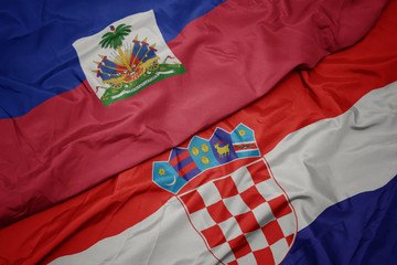 waving colorful flag of croatia and national flag of haiti.