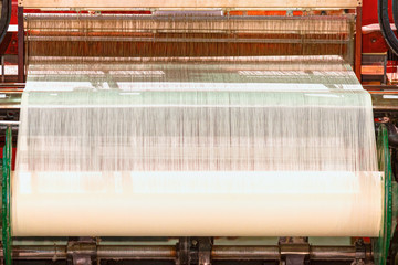 Industrial fabric production line. Weaving cotton at textile factory