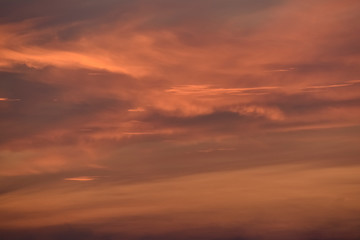 Red tinted colour clouds and skies at day break.
