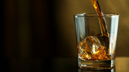 Pouring whiskey into glass