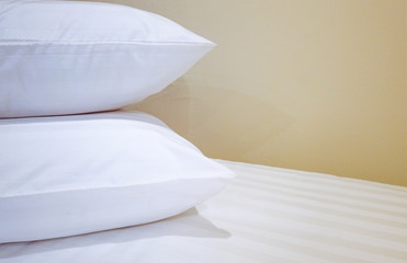double pillows on bed which preparing for guest background.