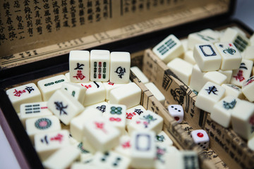 Fototapeta na wymiar Pile of Mahjong ancient asian game in the wooden box