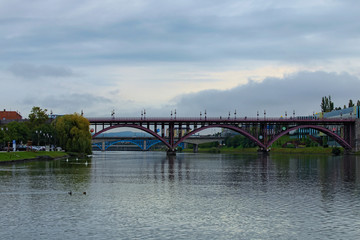 Bridges over Drava River in Maribor. Old Bridge, Titov bridge and Railway bridge. Scenic autumn landscape. Maribor, Slovenia