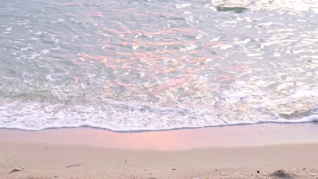 Waves On A Beach with sunset light.