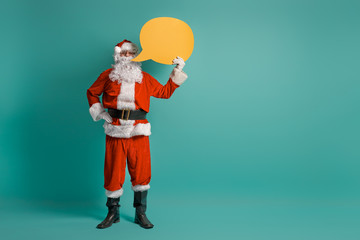 Fototapeta na wymiar Santa Claus on color background.