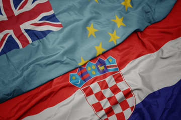 waving colorful flag of croatia and national flag of Tuvalu .