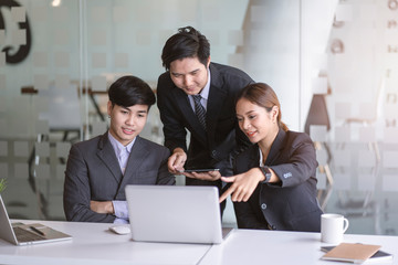 Business team discussing together in conference room during meeting at office. Teamwork, brainstorm and ideas concept. saleperson using tablet and presentation somthing to client.