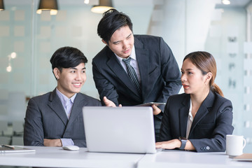 Business team discussing together in conference room during meeting at office. Teamwork, brainstorm and ideas concept. saleperson using tablet and presentation somthing to client.