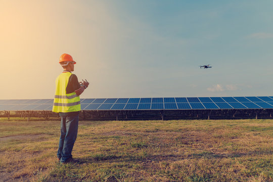 Inspector engineering concept; Engineer inspect and checking solar panel by Drone at solar power plant