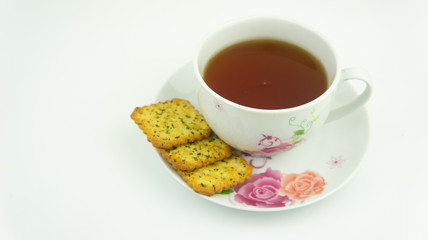Hot tea and vegetable cracker or biscuit . Hi tea or tea break concept.