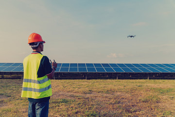 Inspector engineering concept; Engineer inspect and checking solar panel by Drone at solar power plant