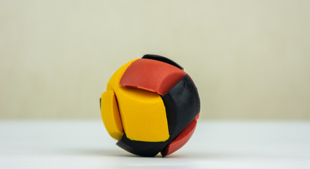 Colorful rubber puzzle ball isolated on white background.