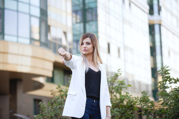 Two woman shows thumb up