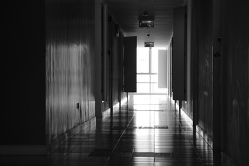 light at end of the corridor inside condominium in monochrome style