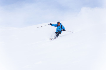 Fototapeta na wymiar Image of sports man with beard skiing