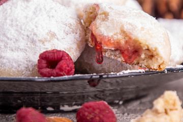 Traditional Christmas cookies biscuits snowballs covered icing sugar povder with almond nut, nutella chocolate an raspberry jam. Christmas New Year ornament decorations.